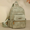 Salbeigrüne Kunstleder-Rucksacktasche im Vintage-Stil mit elegantem Logo-Detail - Grün