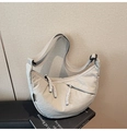 Macro detail of high-density nylon fabric and smooth zipper pullers on grey crossbody bag - Grey Blue