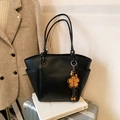 Bolso tote negro de gran capacidad con colgante de flor naranja y bolsillos laterales - Con Colgante / Negro