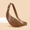 Detail view of the brown caramel crescent bag with stylish knotted strap and metal buckle - Brown
