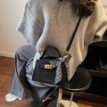 Elegant black matte leather handbag with gold square buckle and patterned silk scarf - Black