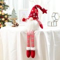 Plush Christmas gnome doll with glowing red snowflake hat and striped long legs - Red Long Legged Faceless Gnome