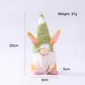 Easter gnome plush doll with green knit hat and pink rabbit ears, size 23cm by 9cm - Green