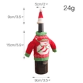 Knitted red Christmas wine bottle cover featuring a snowman pattern and a matching mini hat - Snowman