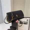 Elegant black saddle bag with smooth leather finish and golden chain handle strap - Black