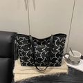 Borsa tote nera con ricamo a stelle, logo dorato e sottili tracolle a spalla - Tipo standard / Nero