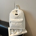 White school backpack with silver star pattern and metal logo plate for students - White
