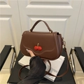 Brown leather square bag with red rhinestone cherry decor and adjustable shoulder strap - Brown