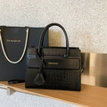 Black leather handbag with faux crocodile texture and gold lettering detail - Black