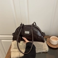 Minimalist deep brown polished leather bowling bag with silver fashion logo plate - Brown