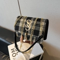 Fashionable black and white plaid tweed shoulder bag with gold S-buckle and chain strap - Black
