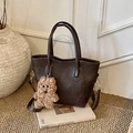 Dark coffee leather bucket bag with top handles and a cute plush puppy charm - With Pendant / Brown