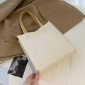 Minimalist cream tote bag with light brown handles and decorative stitching detail - Off-white