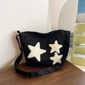 Bolso tote minimalista de lona negra con parches de estrellas crema y correa de hombro - Negro
