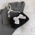 Minimalist black bubble textured shoulder bag featuring a large white satin bow detail - Black