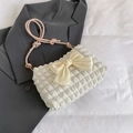 Chic cream-colored bow shoulder bag with waffle texture and pink knotted leather strap - Pink