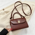 Vintage brown leather crossbody flap bag with a golden circular clasp lock and top handle - Dark Brown