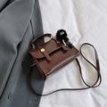 Dark brown glossy faux leather crossbody bag with cute black plush monster keychain - With Pendant / Brown