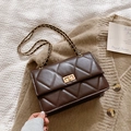 Dark brown quilted leather crossbody bag with golden chain strap on knit fabric - Brown