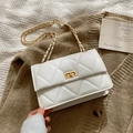 Chic white quilted crossbody bag with gold chain strap and twist-lock on knit background - Off-white