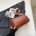 Retro caramel cylinder bag in textured PU leather with wide geometric woven shoulder strap - Brown