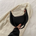Chic black matte crescent shoulder bag with gold-tone hardware on white fabric - Black