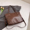 Minimalist dark brown tote bag with retro faux leather texture and golden metal rings - Brown