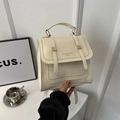 Chic cream white leather travel backpack for women with elegant golden metal hardware - White