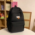 Zaino nero da studente minimalista con etichetta moda e patch con smiley arancione - Nero