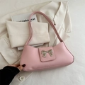 Pink underarm bag for women featuring a stylish silver metal bow decoration - Pink