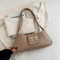 Retro khaki underarm bag with silver bow accent and adjustable shoulder strap for women - Khaki