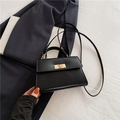 Elegante borsa a tracolla trapezoidale nera con chiusura girevole dorata e manico - Nero