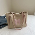 Chic beige straw woven tote bag with pink leather butterfly patch and shoulder straps - Pink
