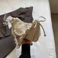 Chic cream-colored crescent bag with pearl chain and pleated handle for women - Off White