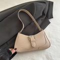 Chic beige crescent hobo bag with a silver buckle detail on a white fabric background - Khaki