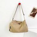 Minimalist solid color khaki shoulder bag with black adjustable strap and logo detail - Khaki