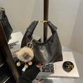 Black leather hobo bag with knotted handle, plush bear charm, and gold metal hardware - With Pendant / Black
