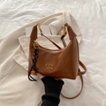 Brown matte crescent hobo bag with gold hardware and woven rope charm detail - With Pendant / Brown