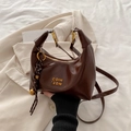 Dark brown crescent hobo bag in glossy leather with gold hardware and logo detail - With Pendant / Coffee