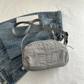Minimalist light grey pleated crossbody bag with adjustable strap and plastic buckle - Gray