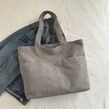 Minimalist grey corduroy tote bag with large front pocket and wide shoulder straps - Gray