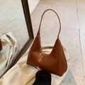 Minimalist vintage brown leather crescent bag with integrated slim handle and embossed logo - Brown