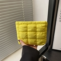 Quilted padded clutch bag in bright yellow featuring a minimalist checkered pattern - Yellow