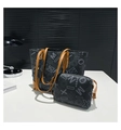 Detail view of large tote bag and matching zipper pouch with letter print and brown leather trim - Black
