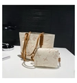 Detail view of white tote bag set with brown straps and vintage letter print pattern - White