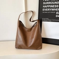 Brown PU leather tote bag with a spacious interior and minimalist shoulder strap design - Tan