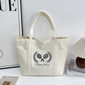 Sac fourre-tout en toile blanc cassé avec motif raquette de tennis et poches latérales - Blanc Cassé