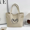 Sac cabas en toile blanc cassé avec imprimé Queen tennis et poches latérales pratiques - Kaki