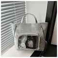 Macro detail of silver tote bag with transparent display window and metallic texture - Silver