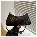Classic black baguette bag with gold metal buckles and stylish twisted knot detail - Black